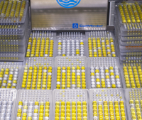 One ColiMinder is performing 48 measurements per day, the picture shows 48 IDEXX Quanti-tray tests. Picture copyright VWM GmbH
