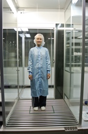 Here the tests being run are on a person standing while wearing a cleanroom gown and bouffant cap