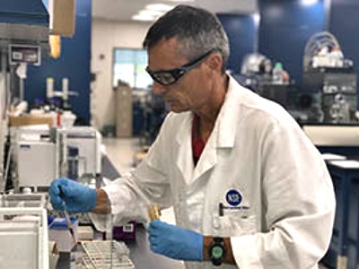 NSF International’s  Senior Research Scientist, John Travis, prepares a hemp extract sample for testing