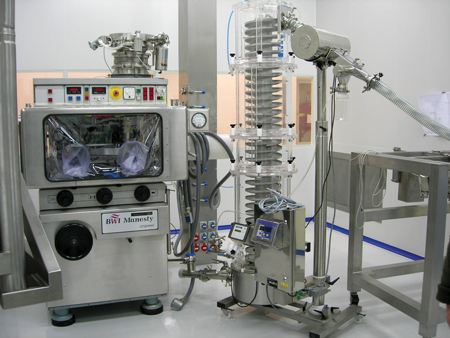 Manesty tablet press with contained de-dusting